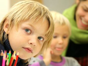 Boy with colored pencils